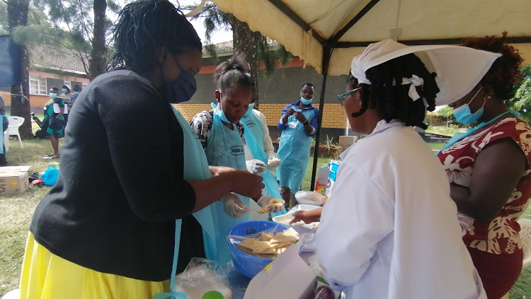 Participants are shown how to make fish samosas, fillets and minced fish in Kisumu