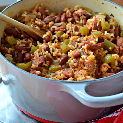 My version of Red Beans and Rice is all cooked up in one big pot.  This mouthwatering combination of onions, peppers, celery, Andouille Sausage, red beans, rice and a perfect blend of spices is a super hearty flavor packed meal.