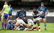 Sanele Nohamba of the Sharks picks up and passes the ball during  yesterday's hard  fought tie against the Blue Bulls.  