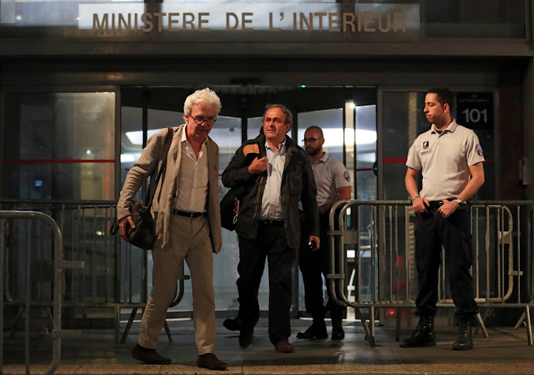 Former head of European football association Uefa Michel Platini leaves a judicial police station where he was detained for questioning over the awarding of the 2022 World Cup soccer tournament, in Nanterre, France June 19, 2019.