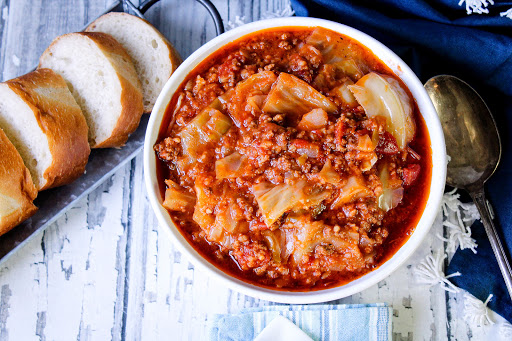 A bowl of Unstuffed Cabbage Rolls with crusty bread.