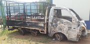 The truck that was found burnt near the bodies of the three men in Dennilton. 