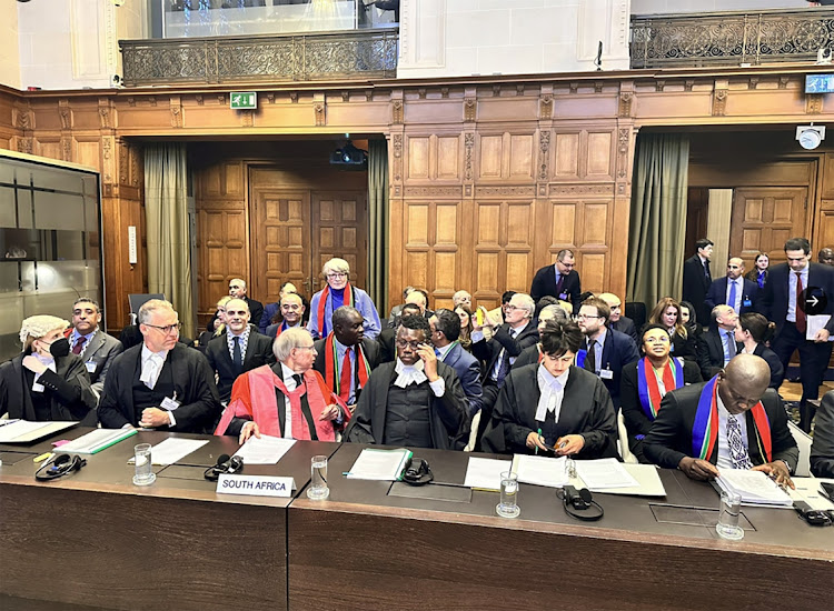 South Africa's Minister of Justice Ronald Lamola and the delegation stand as judges at the International Court of Justice (ICJ) hear a request for emergency measures by South Africa, who asked the court to order Israel to stop its military actions in Gaza and to desist from what South Africa says are genocidal acts committed against Palestinians during the war with Hamas in Gaza, in The Hague, Netherlands, January 11