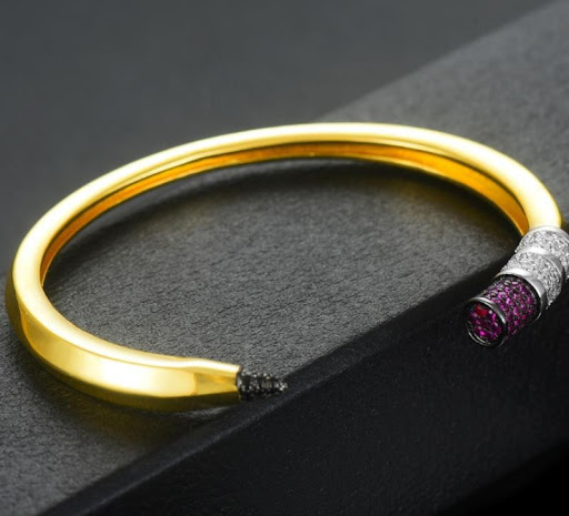 Title 4, Copper Microinset Zircon Pencil Bracelet. A sty...