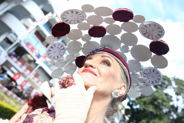 Win Wheeler wearing a hat by her husband Mike at the Durban July.