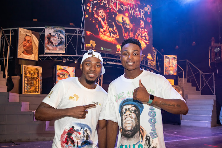 Almighty Moyo , left , and Clement Pilusa share a joke after a boxing match.