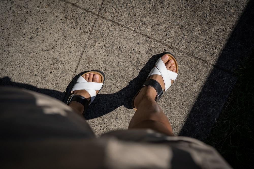 a pair of feet with sandals