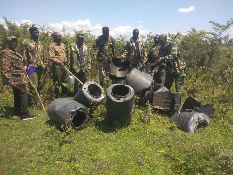 Security officers in Homa Bay empty containers containing illicit brew