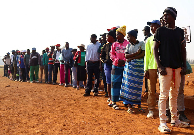 People wait to cast their votes during the Zimbabwe general elections in Kwekwe, outside Harare, on August 23 2023.