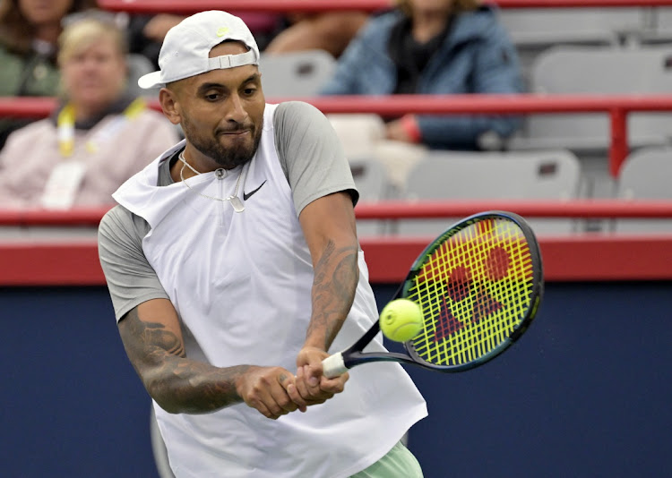 Australia's Nick Kyrgios hits a backhand against Sebastian Baez, of Argentina, in first round play at the National Bank Open at IGA Stadium in Montreal August 9, 2022.