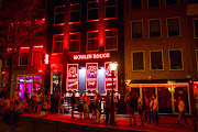 Punters outside a bar in the red-light district Amsterdam. 