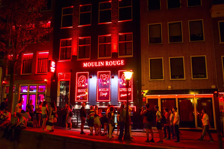 Punters outside a bar in the red-light district Amsterdam.