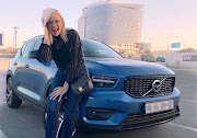 Kandy Kane with her Volvo.