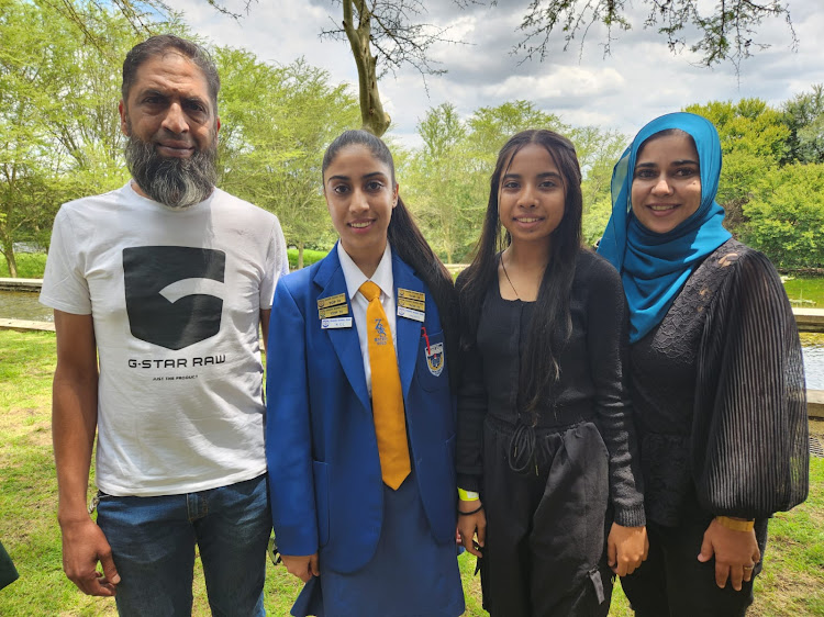 Yusuf Wadee with his daughters, Saffyaah, who is a top pupil from the North West, Sumayyah and his wife, Tasneem.