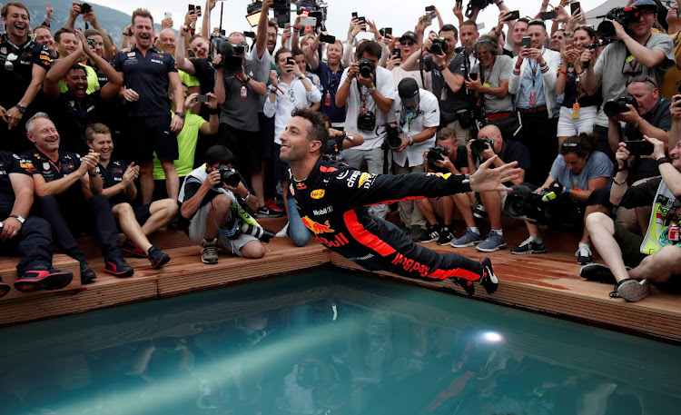 Red Bull feature prominently in the Netflix series, including their split with Renault and Australian driver Daniel Ricciardo (pictured), seen here celebrating after winning last year's Monaco Grand Prix.