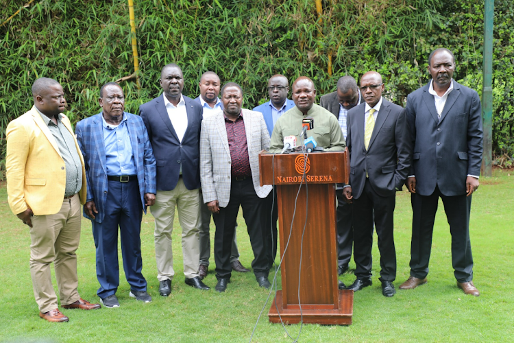 Kakamega Governor Fernandes Barasa alongside Kakamega county lawmakers during a press conference at a Nairobi hotel on November 25, 2023.