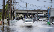 (Bloomberg) -- Record rainfall in Hawaii caused floods, landslides and power outages while prompting an emergency declaration across the state as a powerful Pacific storm dumped a deluge on the islands.