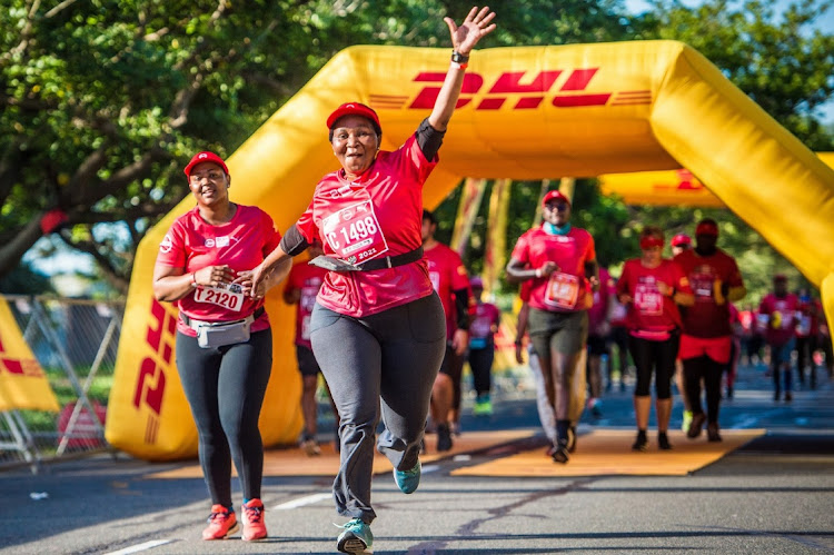 Runners (and walkers) enjoying one of the many exciting on route activations during a previous year’s Absa RUN YOUR CITY Series event.