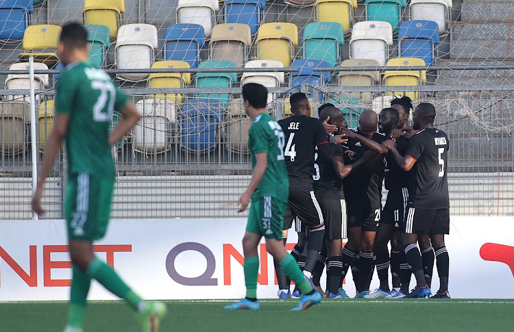 Goodman Mosele of Orlando Pirates is congratulated for scoring his team's second goal in the Caf Confederation Cup semifinal first leg match against Al Ahli Tripoli at the Martyrs of February Stadium in Benghazi, Libya on May 8 2022.