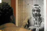 A young Winnie Mandela shot by Alf Kumalo in her Nguni beads, apparently staged as a portrait to send Nelson Mandela in jail.