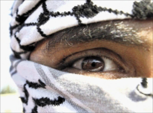 ANGRY: A Jordanian man at a protest in Amman. 29/12/2008. Pic. Ali Jarekji. © Reuters