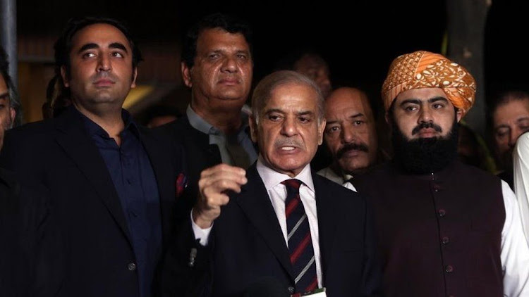 Shahbaz Sharif (centre) led an opposition alliance to vote Imran Khan out