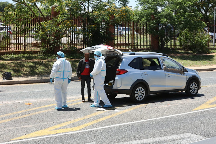 Paramedics cleaning up the Crime scene where shooting occurred in Randburg Magistrate's Court on Wednesday