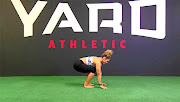 Fitness trainer Stacey Holland shows how to do a burpee. 