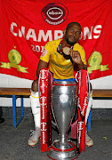 Mosa Lebusa poses with the Absa Premiership trophy after Saturday's  match against Stars at Goble Park.    /  gallo images/ Steve Haag