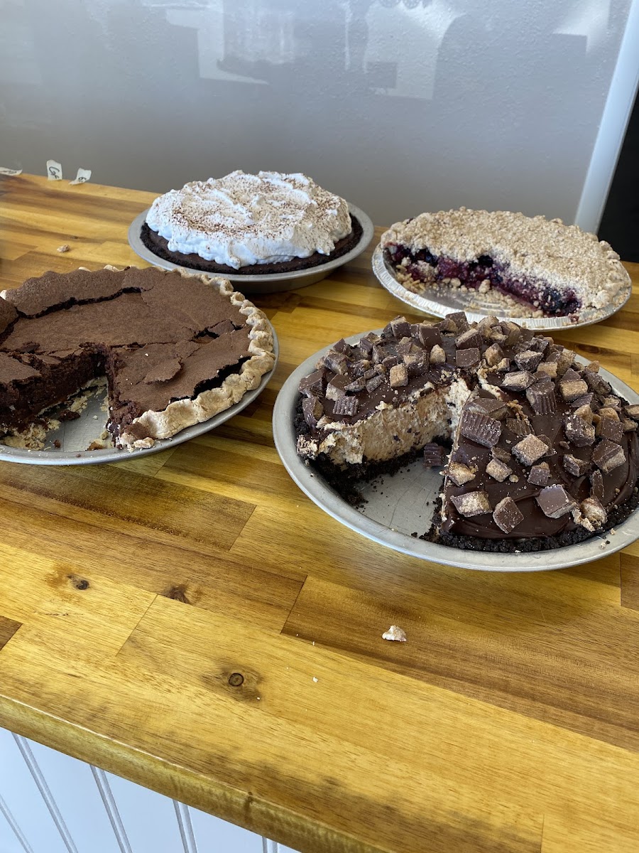 Peanut butter with Reese’s pie, Kahlua brownie pie, chocolate cream pie and crumb cherry pie