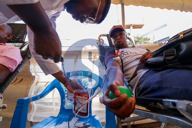 A nurse collects blood sample during a blood drive exercise conducted by Kenya Red-Cross near National Archives Nairobi on Tuesday 28, 2022.