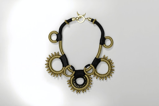 Jeweller Pichulik created a necklace inspired by the innate nature of the coins - the historical value and physical elements like the gold, the weight and the circles.