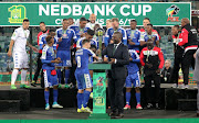 Dean Furman collects the trophy the trophy during the Nedbank Cup final match between Orlando Pirates and SuperSport United at Moses Mabhida Stadium on June 24, 2017 in Durban, South Africa. 