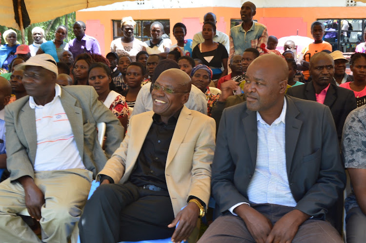 Boni Khalwale with other mourners during a funeral in Malava on Saturday