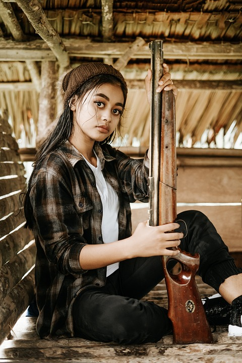 Girl Holding Gun