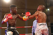 Luyanda Ntwanambi in action against Fikile Mlonyeni during the vacant WBO Africa flyweight title fight