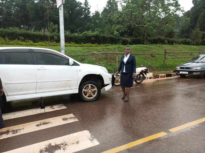 Lawyer Malende standing beside her car after its tyres were deflated