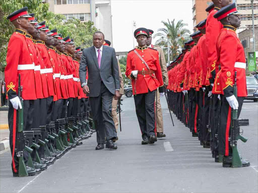 President Uhuru Kenyatta inspects a guard of honour before issuing the State of the Nation address at Parliament buildings, March 15, 2017. /PSCU