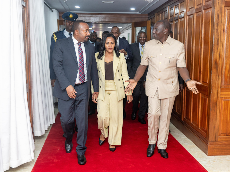 Ethiopia Prime Minister Abiy Ahmed is received by President William Ruto on arrival at the Jomo Kenyatta International Airport at the start of his State visit on February 27, 2024.