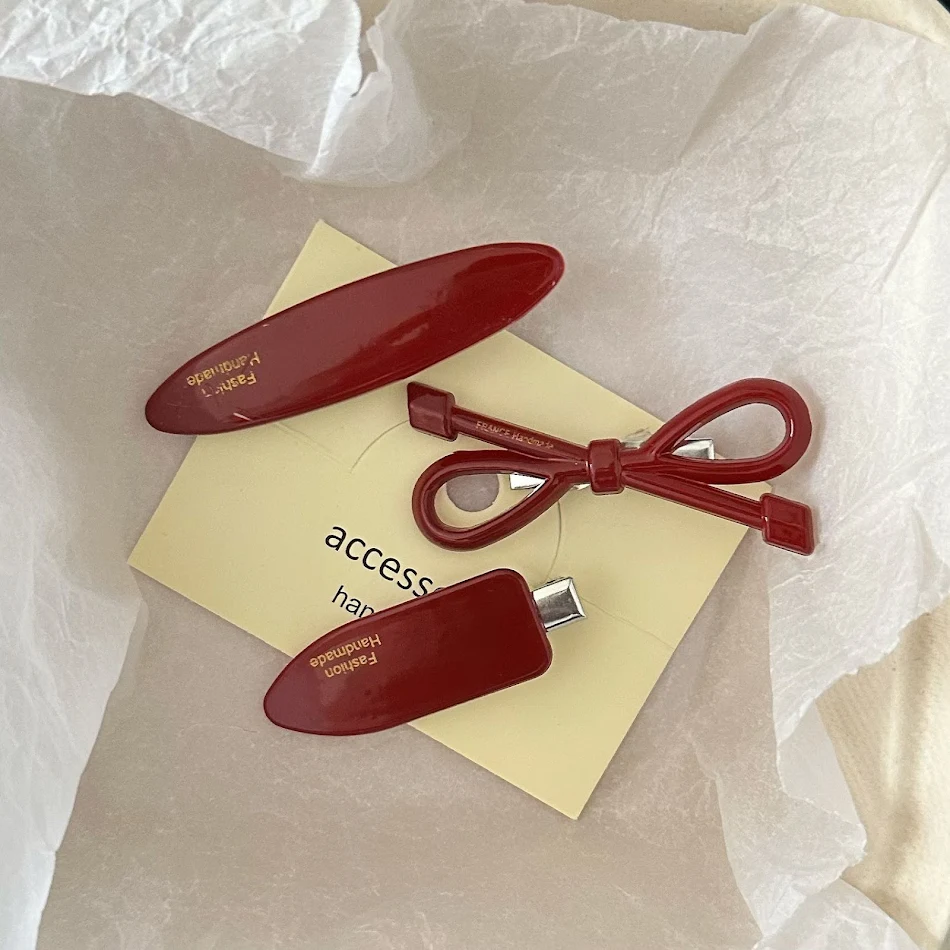 Barrettes latérales XINGX rouges pour femmes, élégantes et sûres. Coiffures impeccables grâce à ces pinces à cheveux modernes.