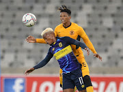 Khanyisa Mayo of Cape Town City beaten in the air by Thabani Dube of Kaizer Chiefs in the DStv Premiership game at Cape Town Stadium on February 15 2022.