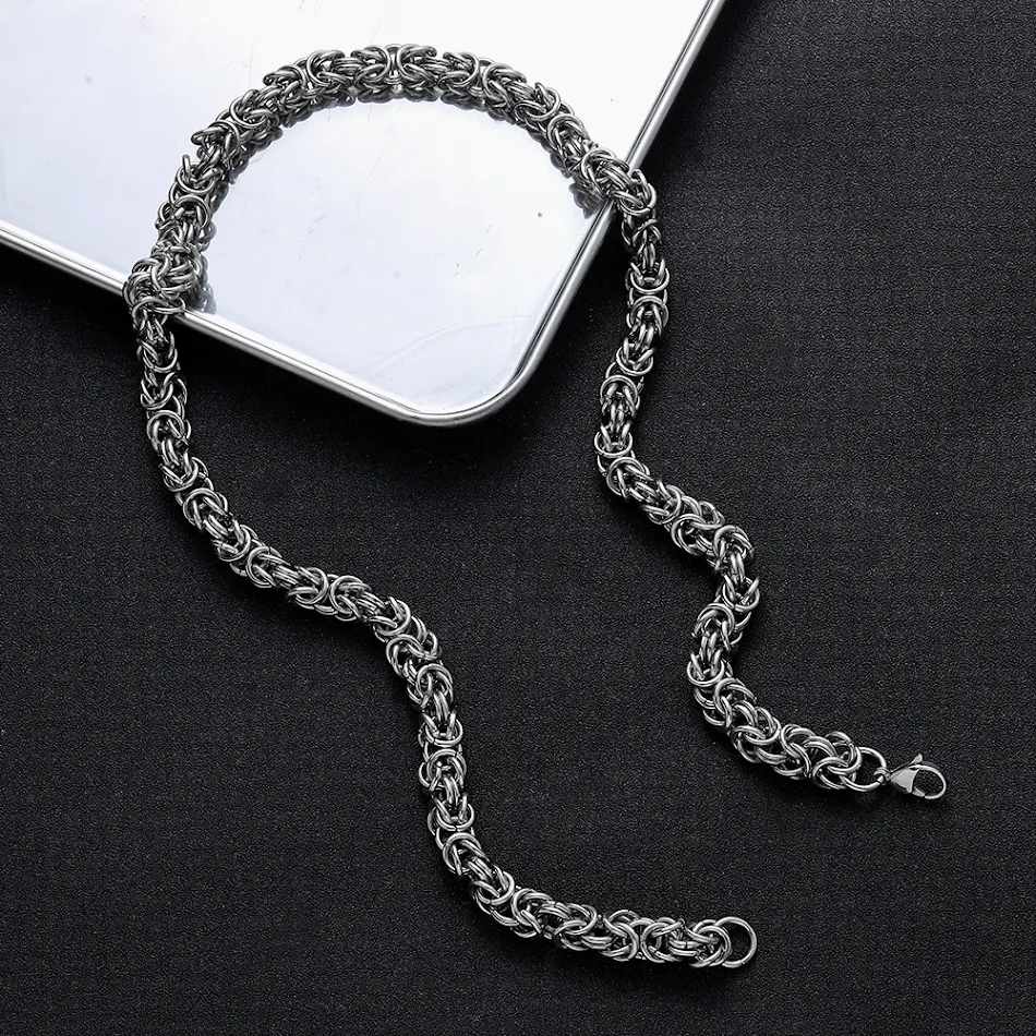 Chaîne Domineering Hip Hop en acier inoxydable, tissée à la main, avec un design de chaîne de quille. Un style audacieux et une résistance à toute épreuve.