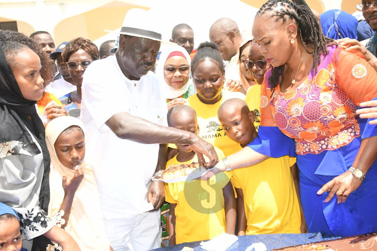 Azimio Leader Raila Odinga sharing cake with kids during celebrations of his 79th birthday in Malindi on Saturday, December 7, 2024.