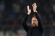 Chelsea manager Graham Potter applauds the fans following their side's victory against AC Milan in the Uefa Champions League group E match at Giuseppe Meazza Stadium in Milan on October 11 2022.