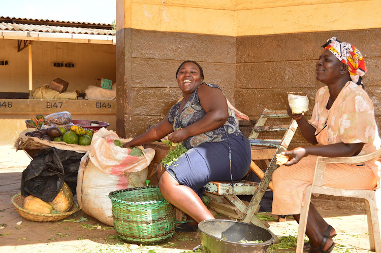 Mama mboga selling vegetables in Kakamega.