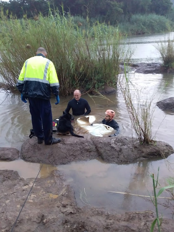 Police search and rescue unit divers recover the body of a 16-year-old boy who drowned while fishing in the Umzimkulu River, on the KZN South Coast, on Sunday.