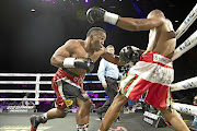 Thabiso Mchunu connects with body shots of Namibian Wilberforce Shihepo, who  retired in his corner after two rounds.