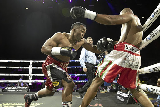 Thabiso Mchunu connects with body shots of Namibian Wilberforce Shihepo, who retired in his corner after two rounds.