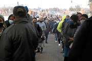 Passengers queue for transport at the  Rea Vaya bus stop in Soweto  during Level 4 of the lockdown.