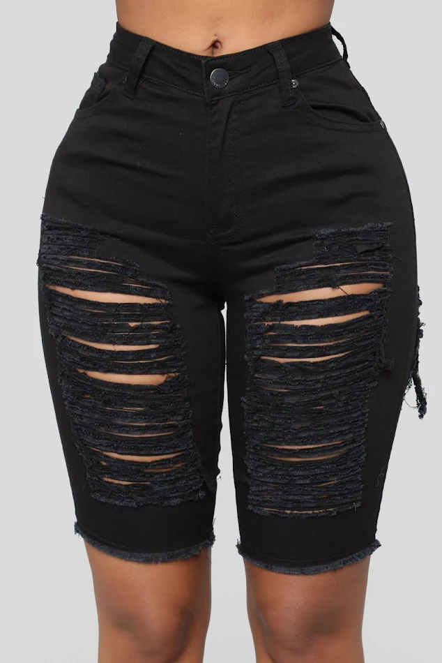 Pantalon taille haute noir stretch déchiré style hot, série stand-alone, pour un look tendance et une silhouette affinée